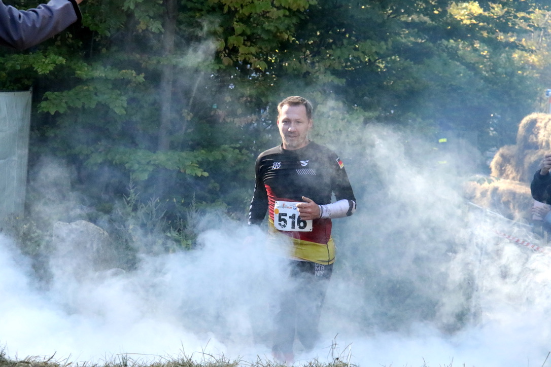Athlete runs through fog to the finish line